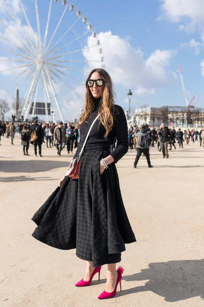 PARIS - OCTOBER 2016: Stylish woman during Paris Fashion week. With Fashion week in New York, London and Milan, they are the four biggest fashion events in the world - Photo, Image