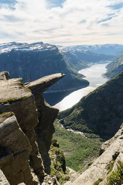 Norway tourism attraction - Trolltunga (Troll's Tongue) rock in Hordaland county. Ringedalsvatnet lake - Φωτογραφία, εικόνα
