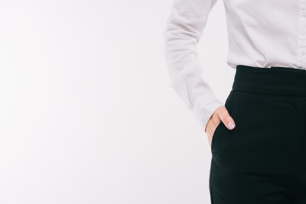 cropped image of businesswoman standing with hand in pocket isolated on white - Фото, зображення