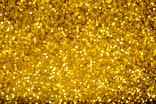 Χρυσό glitter αφρώδη σχεδιαστικό υπόβαθρο, θολή για να δημιουργήσετε έξω από εστίαση bokeh για εικόνες υψηλής αξίας ή πολυτελή σχεδιασμό intenationally - Φωτογραφία, εικόνα
