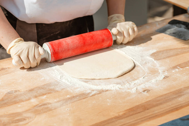 Woman Chef Hands baking dough with rolling pin - Photo, Image