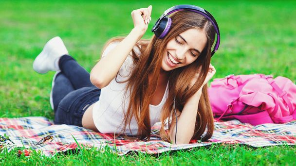 Young Woman Listening Music In Headphones - Фото, изображение