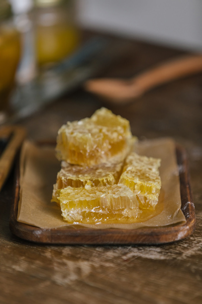 close-up shot of sliced honeycomb on rustic wooden table - Fotografie, Obrázek