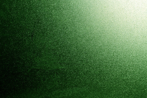 Ground glass texture in green with light in corner. abstract background and pattern for designers. - Photo, Image