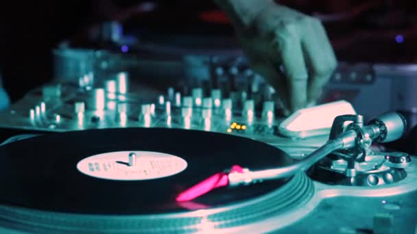 Performance of a DJ while putting music with old vinyl - Footage, Video
