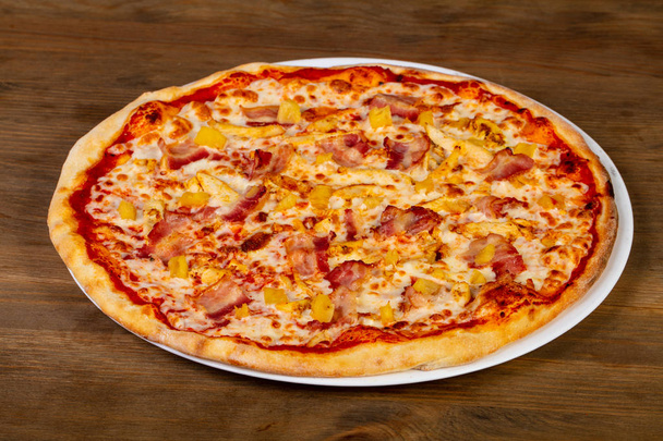 Pizza with bacon, cheese and pineapple - Photo, Image