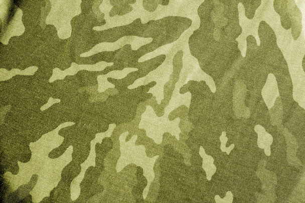 Old camouflage cloth with blur effect in blue tone. Abstract background and texture for design abd ideas. - Photo, Image