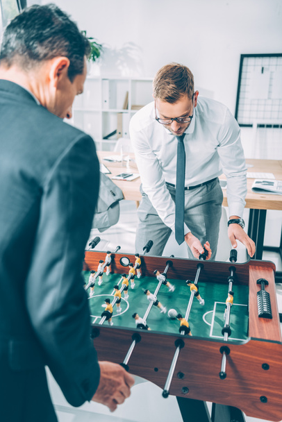 handsome businessmen playing table football in modern office - Photo, Image