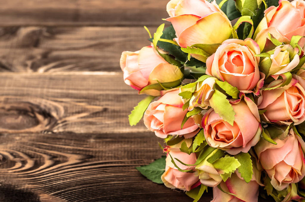 Bouquet of roses, background for mother's day or card for women's day, flowers on wooden table - Fotoğraf, Görsel