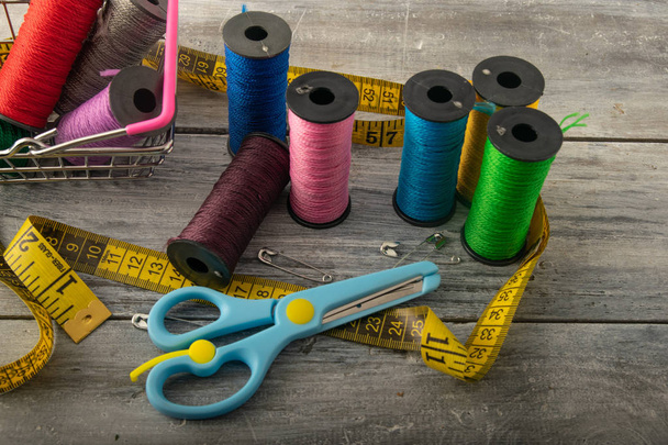 colored threads with a line of meters. on a light background - Photo, Image