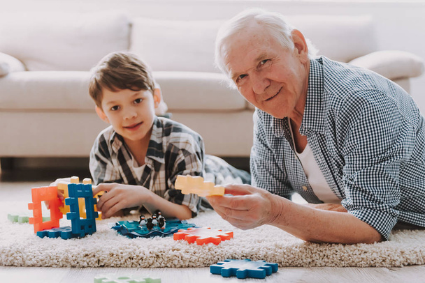 Portrait Grandpa and Grandson Playing with Toys. Family Relationship Between Grandfather and Grandson. Grandpa Teaching, Male Grandchild, Learning Concept. Relations and People Concept. - Photo, Image