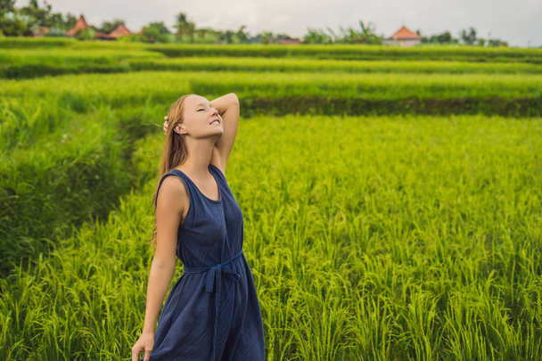 Young woman posing at Green cascade rice field plantation, Bali, Indonesia. - Фото, зображення