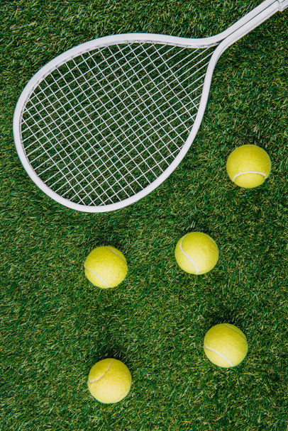 top view of tennis equipment of green grass - Фото, изображение