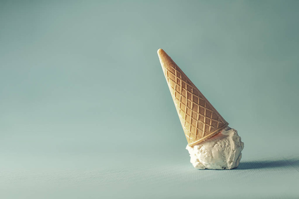 sweet white ice cream on pastel blue background - Zdjęcie, obraz