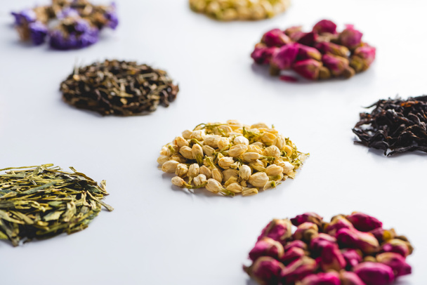 collection of dried herbal healthy tea on white surface - Foto, Bild