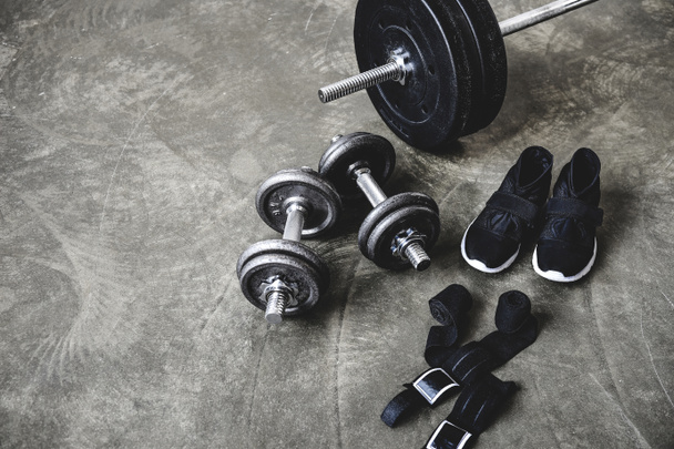 various workout equipment on concrete surface - 写真・画像