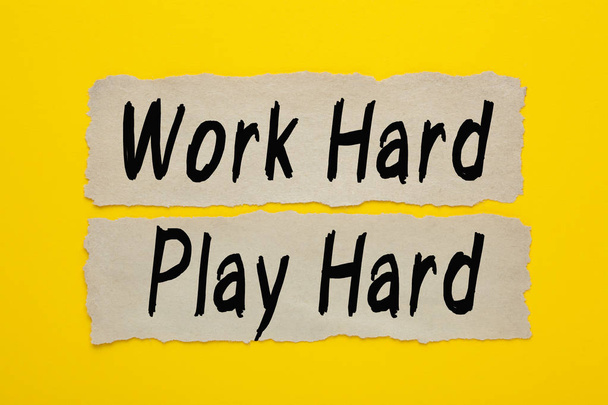 Work Hard Play Hard written on old paper on yellow background. Business concept. - Photo, Image
