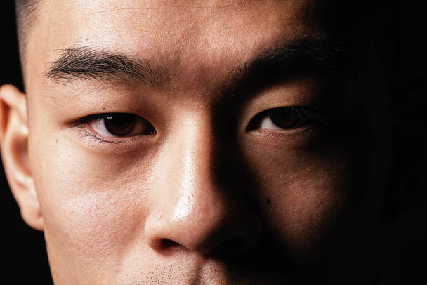 Close detail of the eye of an asian man. Asian people concept - Zdjęcie, obraz