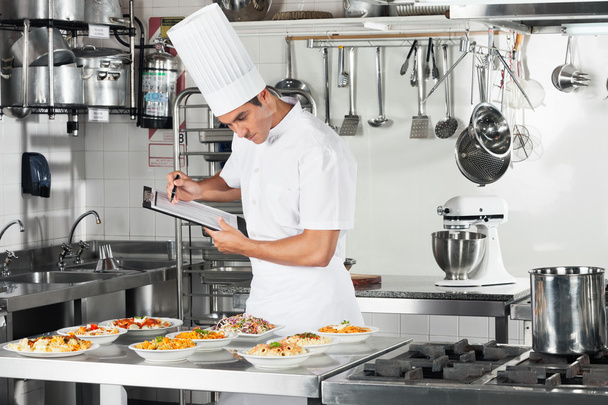 Chef With Clipboard Going Through Cooking Checklist - Fotoğraf, Görsel