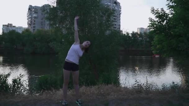Beautiful girl doing exercises for hands - Video, Çekim