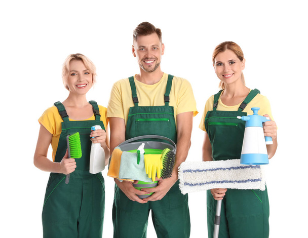 Female janitors with cleaning equipment on white background - Foto, Imagen