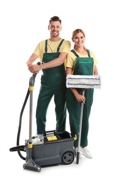 Female janitors with cleaning equipment on white background - Foto, Bild