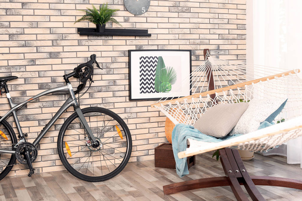 Modern bicycle in stylish hallway interior - Фото, зображення