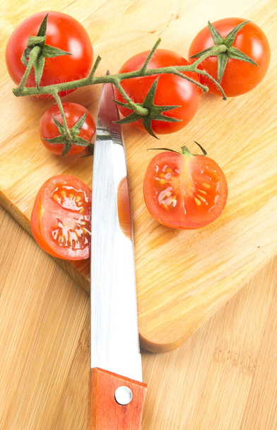 Knife and small tomatoes - Фото, зображення