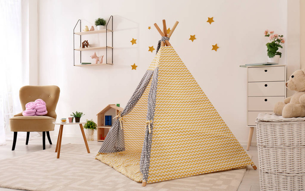 Cozy kids room interior with play tent and toys - Zdjęcie, obraz