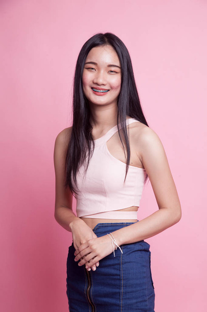 Portrait of beautiful young Asian woman on pink background - Φωτογραφία, εικόνα