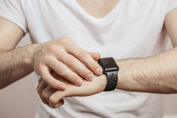 modern watch on wrist isolated on a white background - Фото, зображення