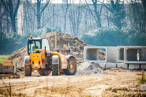 tractor at construction site  - Фото, изображение