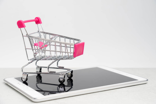 Collection of shopping cart  full of shopping time.Top view or flat lay composition cart on color background.online shopping concept. - Photo, Image