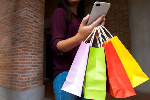 Woman using smartphone for shopping online, shopping concept. - Valokuva, kuva