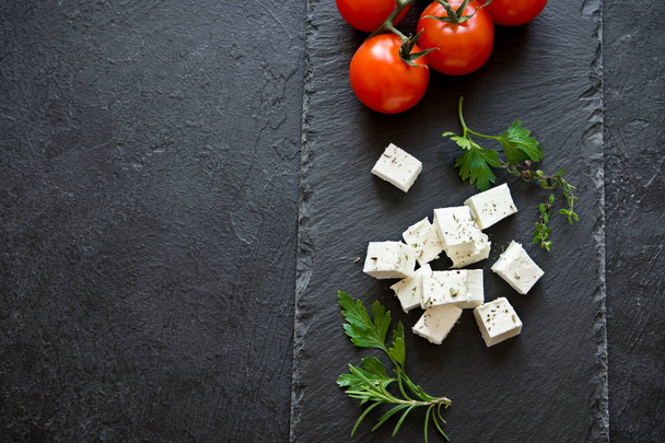 Fresh Greek Feta Cheese. Healthy ingredient for cooking salad. Goat feta cheese with herbs. - Foto, Bild