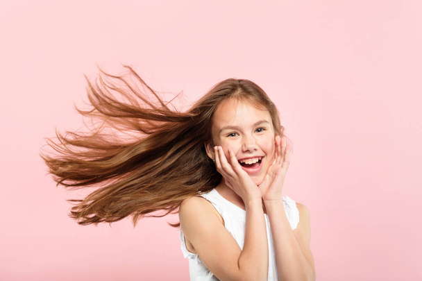 pretty cute girl hair flying care health product - Foto, Imagem
