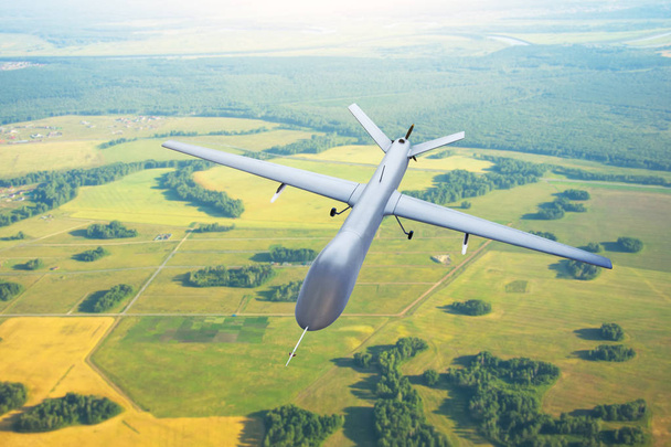 Patrolling unmanned aircraft in the sky above the terrain, fly tracking - Photo, Image