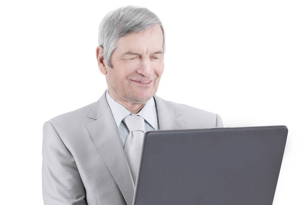 closeup.handsome senior businessman working on laptop. - Photo, Image
