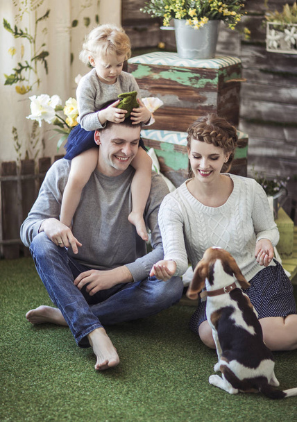 happy family and pet dog on the background of country house - Фото, изображение