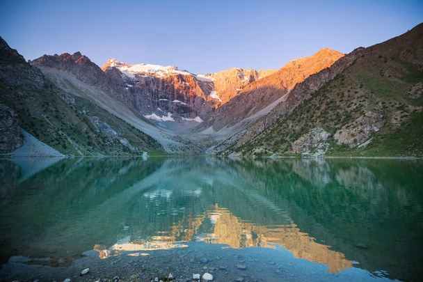 Beautiful serene lake in  Fanns mountains (branch of Pamir) in Tajikistan. - Photo, Image