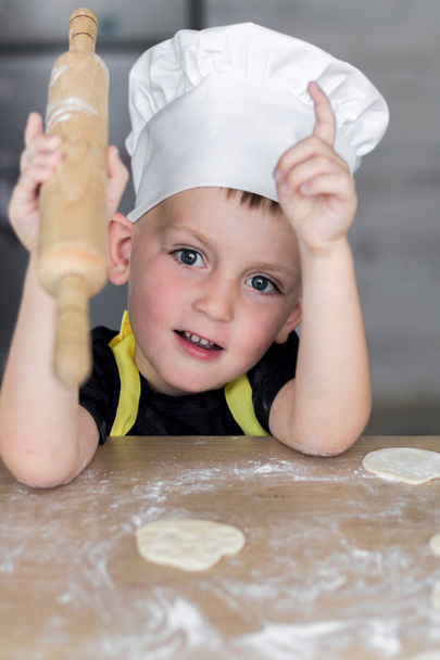 Baby Cook Cooks from the Dough. Culinary Concept - Фото, изображение