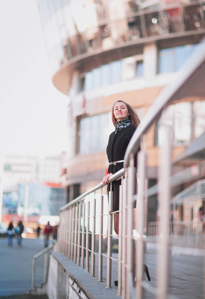 Portrait of confident business woman against a modern office building - Foto, Bild
