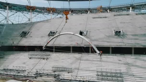 Work of a crane on a construction stadium site - Footage, Video