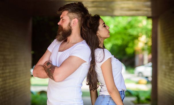 Couple in love can not find same point of view. Girl attractive brunette bearded hipster man stand back to back porch underground crossing. Couple problems relationship. Couple has disagreements. - Φωτογραφία, εικόνα