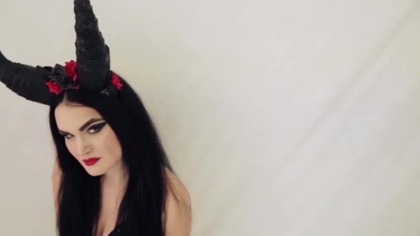 girl in a fairy-tale image with horns on her head - Felvétel, videó