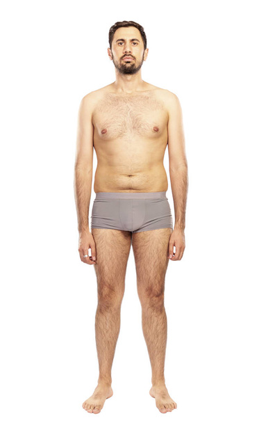 Man without clothes, in shorts, isolated on white background - Valokuva, kuva