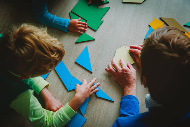 teacher and kids playing with geometric shapes - 写真・画像