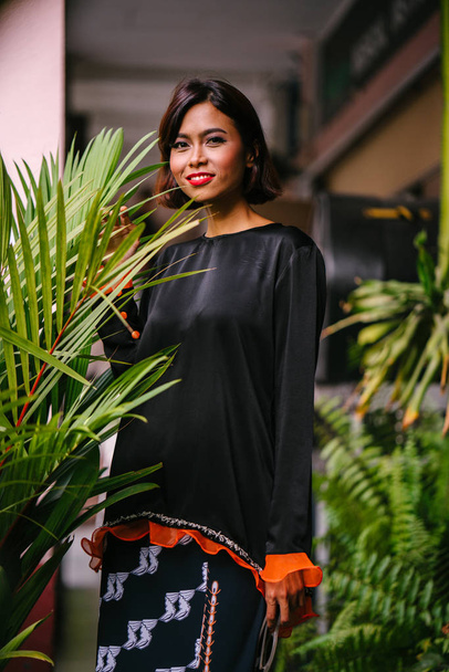 Portrait of a young, attractive and photogenic Singaporean Malay woman  - Foto, Imagem