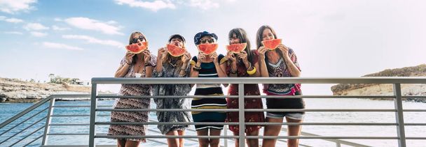 group of women posing with watermelon and smiling  - Foto, Imagen