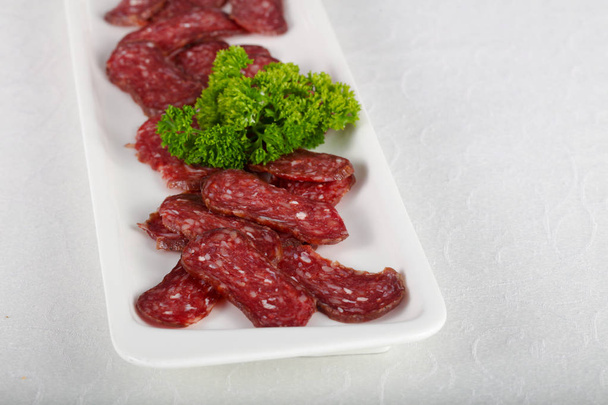 Beef basturma meat on white plate - Photo, Image
